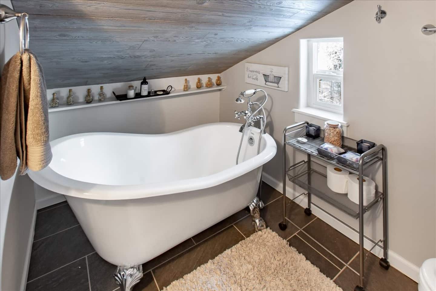 Upstairs bathroom with a freestanding soaking tub
