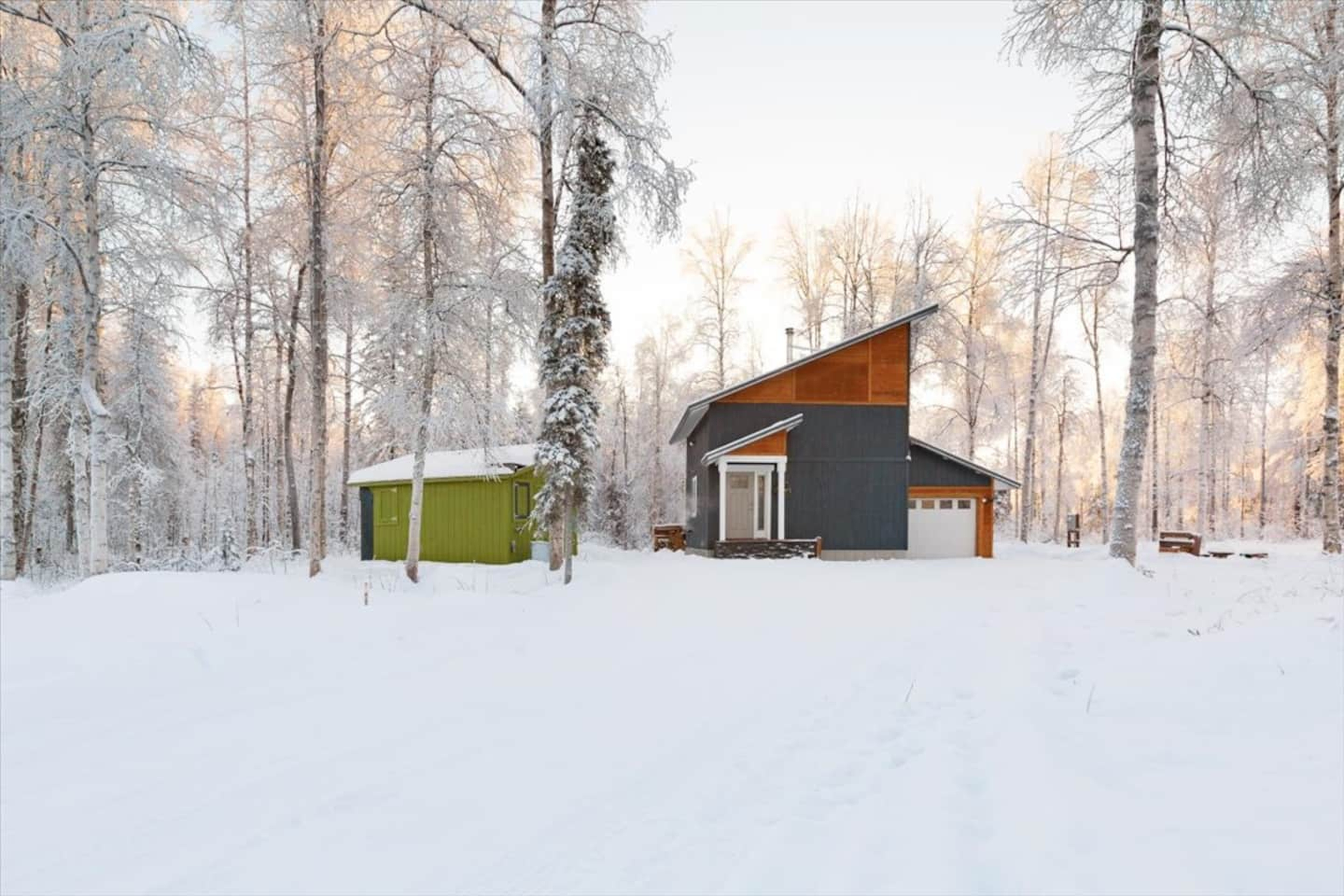 Compass Cabin tucked into the winter woods near Talkeetna